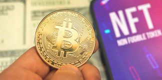 Person holding Bitcoin coin, NFT text on screen
