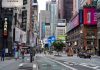 Times Square street scene with storefronts and advertisements
