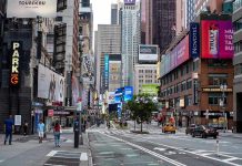 Times Square street scene with storefronts and advertisements