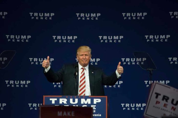 487546267 Man giving thumbs up at Trump Pence rally