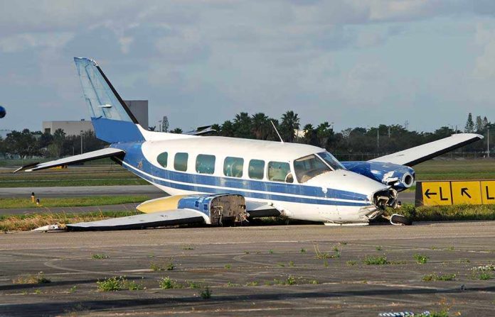 shutterstock_2445734.jpg Damaged blue and white small airplane on an airport runway