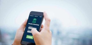 Person using mobile banking app on smartphone.