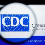 CDC Upheaval: Top Brass Walk Out CDC logo magnified on a screen.