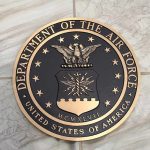 Bronze seal of the Department of the Air Force on a tiled surface
