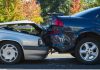 Two cars involved in a rear-end collision on a city street