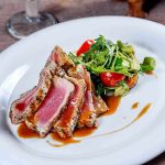 Unexpected Diet Trick Extends Brain Cancer Survival Plated seared tuna with a fresh salad on the side