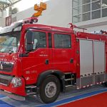 Red fire truck displayed at an exhibition