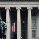 Treasury Building Breach Sparks Security Fears US Treasury Department building with statue and flag