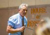 Man speaking outside House of Representatives building