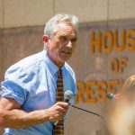Man speaking outside House of Representatives building