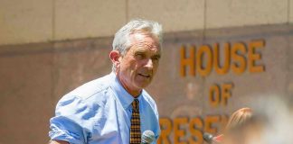 Man speaking outside House of Representatives building