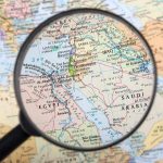 Magnifying glass over the Middle East and Egypt