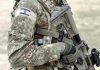 Soldier in camouflage gear with Israeli flag patch