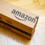30,000 Jobs GONE: Amazon’s Drastic Move Amazon package on wooden floor