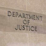 $230M Demand Stirs Unprecedented DOJ Conflict Department of Justice sign on a building