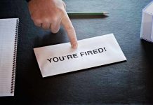 Envelope with YOURE FIRED and pointing finger