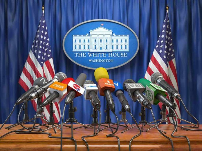 1186435138 Multiple microphones at White House press briefing podium