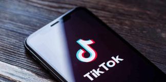 Phone screen showing TikTok logo and app