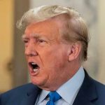 Trump BLASTS Meyers: “Deranged Lunatic!” Sparks Media War Man in suit with open mouth speaking passionately