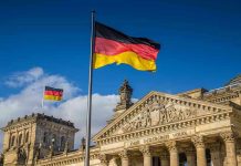 SHOCKING Holocaust Sale Triggers Global Outrage German flags at the Reichstag building in Berlin.