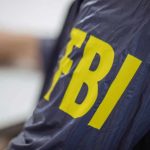 Assassination Investigation EXPLODES – Tucker’s Bombshell Claims Jacket with FBI letters in yellow.