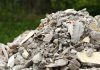 A large pile of construction debris consisting of broken concrete and other materials