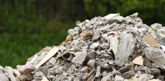 A large pile of construction debris consisting of broken concrete and other materials