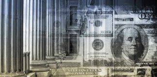 Architectural columns with a background of U.S. currency