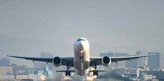 An airplane taking off from an airport runway
