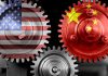 Interlocking gears with USA and China flags.