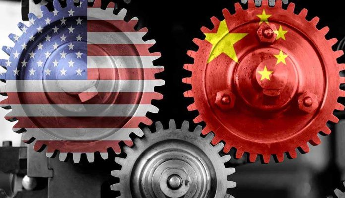 1849129522 Interlocking gears with USA and China flags.