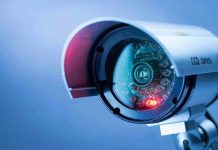 Hacked Cameras Expose MILLIONS – Privacy Crisis Close-up of a CCTV security camera.
