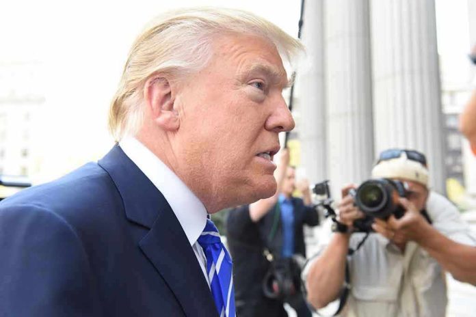 307005065 Man in suit with photographers in background.