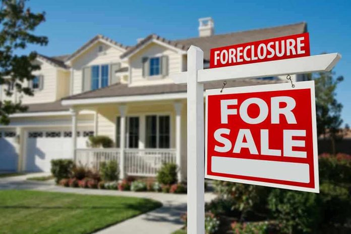 Foreclosure sign in front of a house for sale