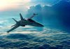 A fighter jet flying above the clouds during sunset