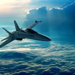 A fighter jet flying above the clouds during sunset