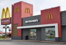 Fast Food Giant Sued Over Lie McDonalds restaurant exterior with logo and drive-thru sign.
