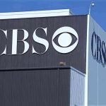 Exterior view of a CBS media building featuring the CBS logo