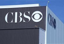 Exterior view of a CBS media building featuring the CBS logo