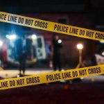 Contractor With 112 Violations Running Deadly Facility Yellow police tape in front of crime scene.