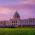 Supreme Court Shocker: Alabama Map Boosts GOP Historic building with dome under a pinkish-purple sky.