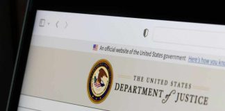 Close-up of the U.S. Department of Justice website on a computer screen