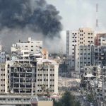 Trump Threatens Iran’s Existence City buildings with heavy smoke and extensive war damage
