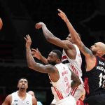 Basketball players competing for the ball during a game