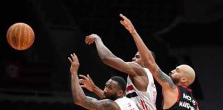 Basketball players competing for the ball during a game
