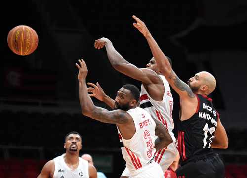 Basketball players competing for the ball during a game