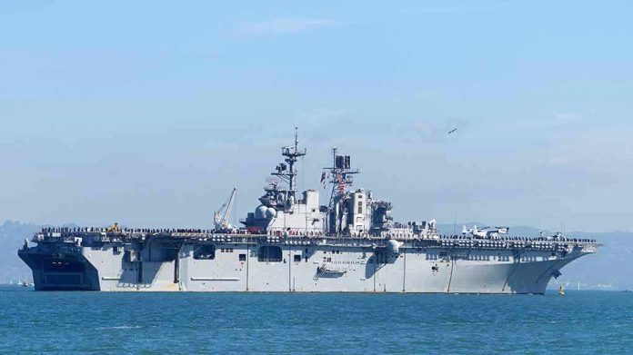Aircraft carrier sailing on calm blue water