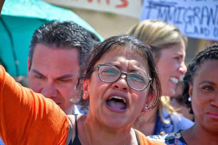 Woman with glasses shouting at a rally