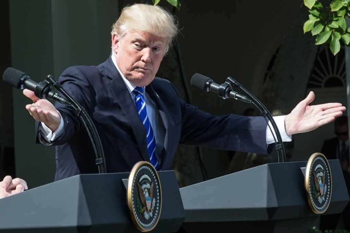 man at podiums with arms outstretched during outdoor press event
