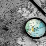 Magnifying glass highlighting Taiwan on a map